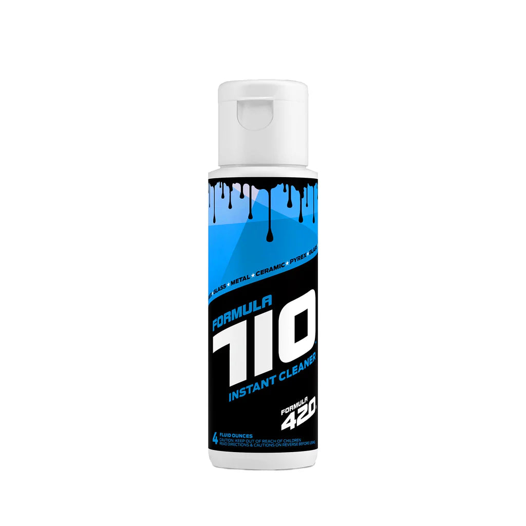 Front view of the Formula 710 Instant Cleaner C2 Wash bottle in clear plastic with a vibrant blue and black label. Featuring patented AbrasivAction technology, this powerful solution uses scrubbing crystals to instantly remove sticky wax and oil buildup from glass concentrate rigs without the need for soaking.