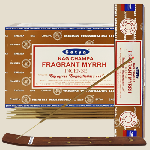 Front view of the Satya Incense 15g 12-Count Display box in the Fragrant Myrrh variant featuring deep orange highlights. This combustible agarbatti stick display unit is ideal for vertical counter placement to drive impulse checkout transactions.