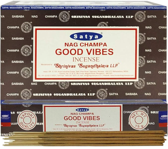 Front view of the Satya Incense 15g 12-Count Display box in the Good Vibes variant featuring colorful rainbow typography. This combustible agarbatti stick display unit is ideal for vertical counter placement to drive impulse checkout transactions.