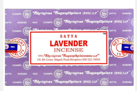 Front view of the Satya Incense 15g 12-Count Display box in the Lavender variant featuring soft purple color tones. This combustible agarbatti stick display unit is ideal for vertical counter placement to drive impulse checkout transactions.