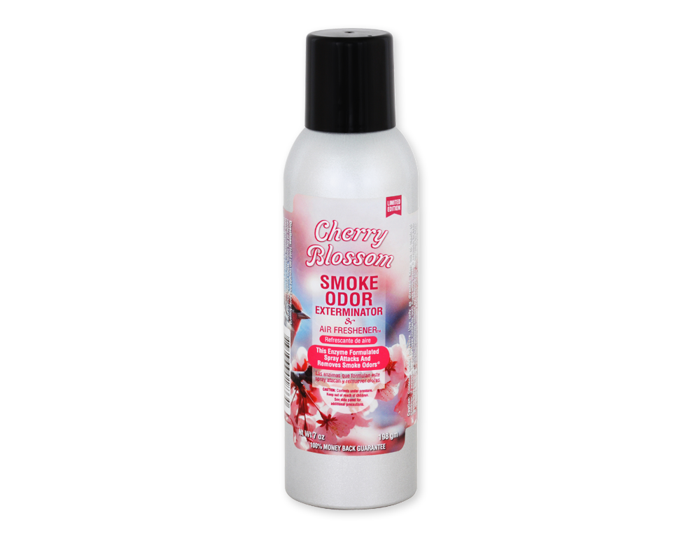 Front view of the Smoke Odor Exterminator Air Freshener 7oz in a white and pink cherry blossom design. This aluminum aerosol canister features an active enzyme formula that physically binds to and neutralizes airborne smoke and environmental smells.