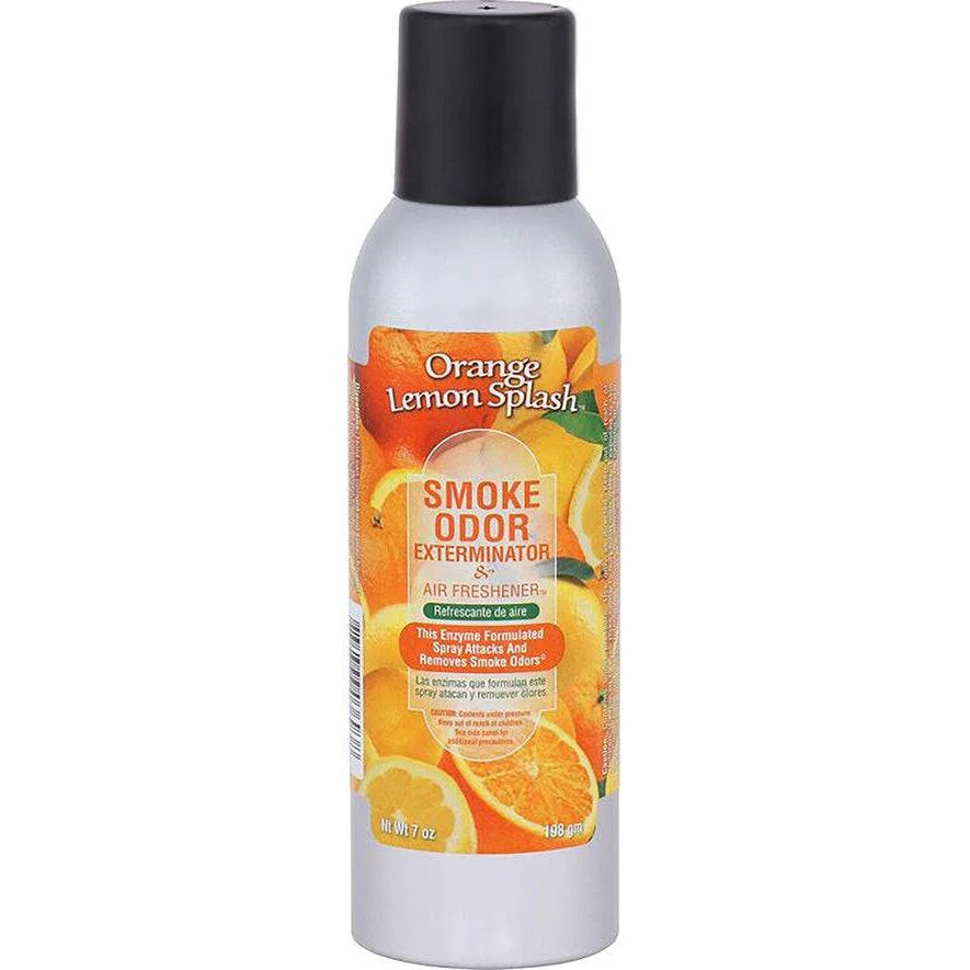Front view of the Smoke Odor Exterminator Air Freshener 7oz in an orange and yellow Orange Lemon Splash design. This aluminum aerosol canister features an active enzyme formula that physically binds to and neutralizes airborne smoke and environmental smells.