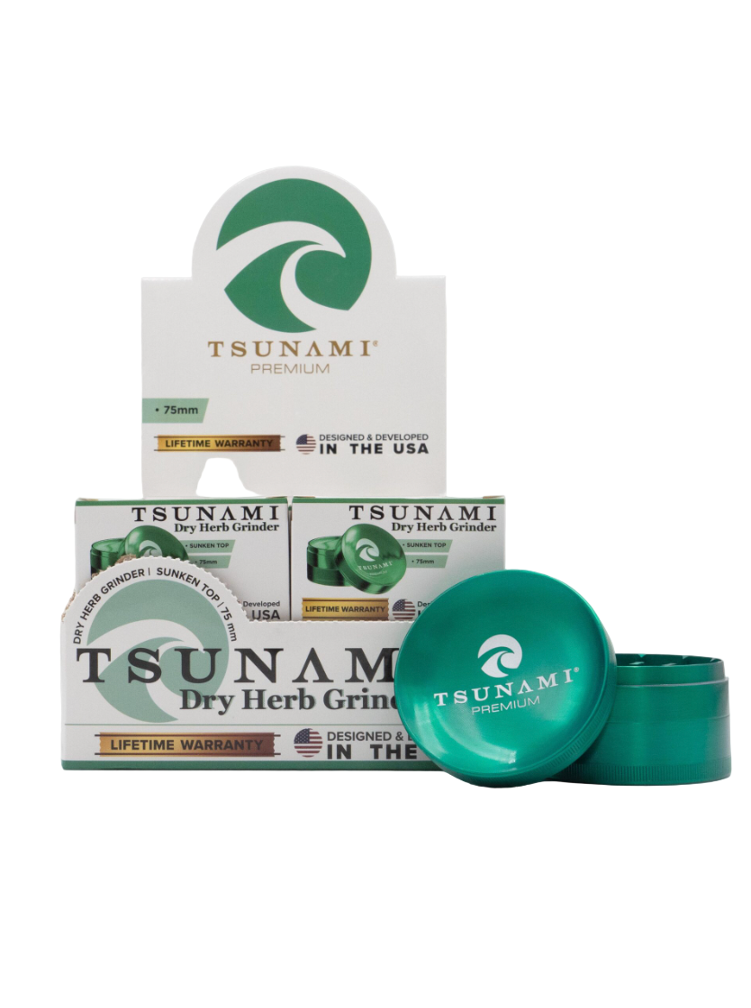 Front view of the Tsunami 75mm Concave Top Herb Grinder display in green. This oversized 4-piece dry herb grinder features a built-in concave mixing bowl on the magnetic lid and sharp diamond teeth for a smooth, even grind.
