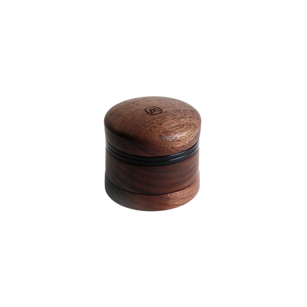 side profile view of the Marley Natural small 4 pice grinder. Made of black walnut. this is a quality accessory for smokers who need quality.