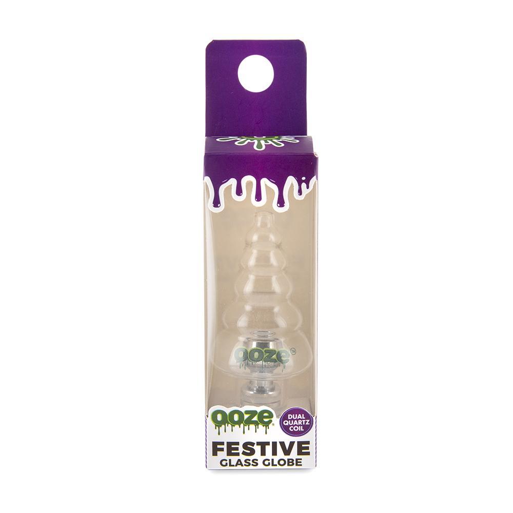 front view of the ooze festive glass globe atomizer and its purple packaging.