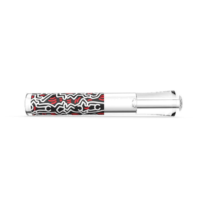 Angled overhead view of the K.Haring black and white glass taster focusing on the deep packing bowl and built-in ash catcher pinch. This ergonomic glass construction provides incredibly smooth, flavorful draws while actively keeping unwanted debris out of the mouthpiece.