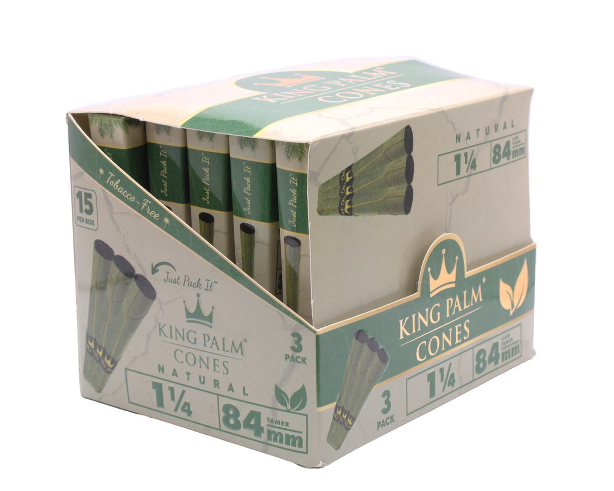 Angled overhead view of the open King Palm mini display box. The black and green wholesale carton houses fifteen individual foil pouches precisely formatted for rapid retail turnover.