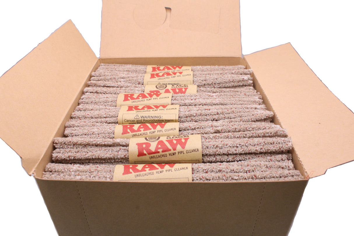 Angled overhead view of the open RAW hemp pipe cleaners box showcasing the brown, red, and black branding. This 48-count display provides unbleached, vegan-friendly tools wrapped around a flexible iron core for maintaining glass pieces.