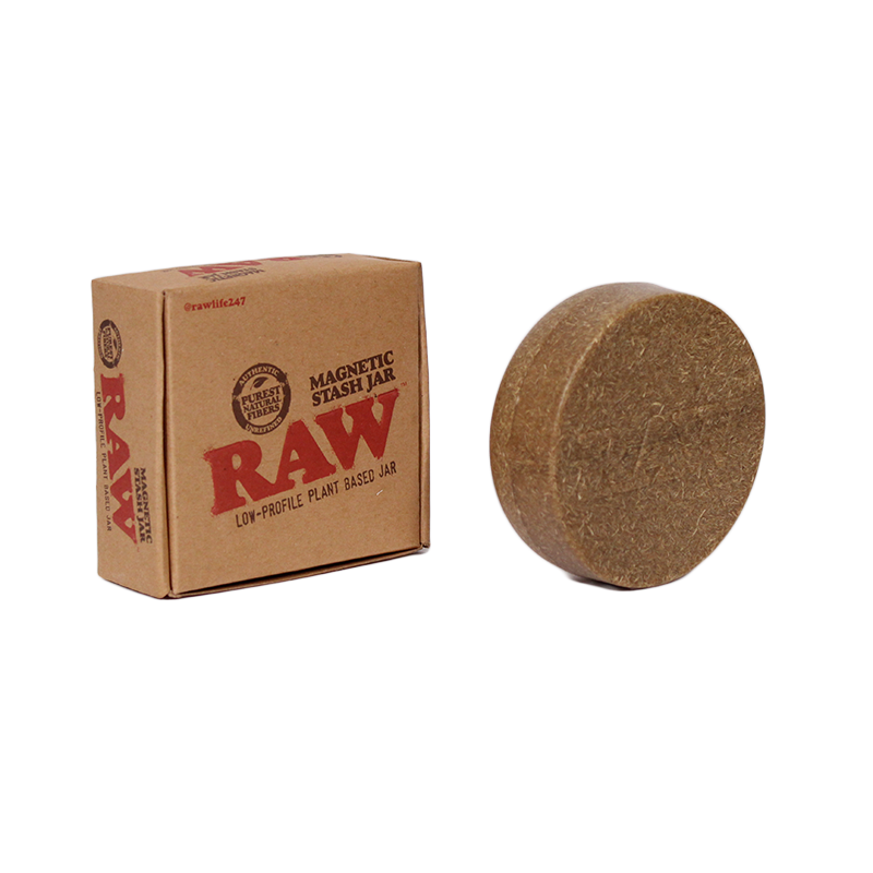 Front angled view of the RAW Magnetic Stash Jar in brown with a RAW logo on the lid. Featuring a strong magnetic base, this discreet, pocket-sized container easily attaches to metal rolling trays to prevent accidental spills of your botanical extracts.