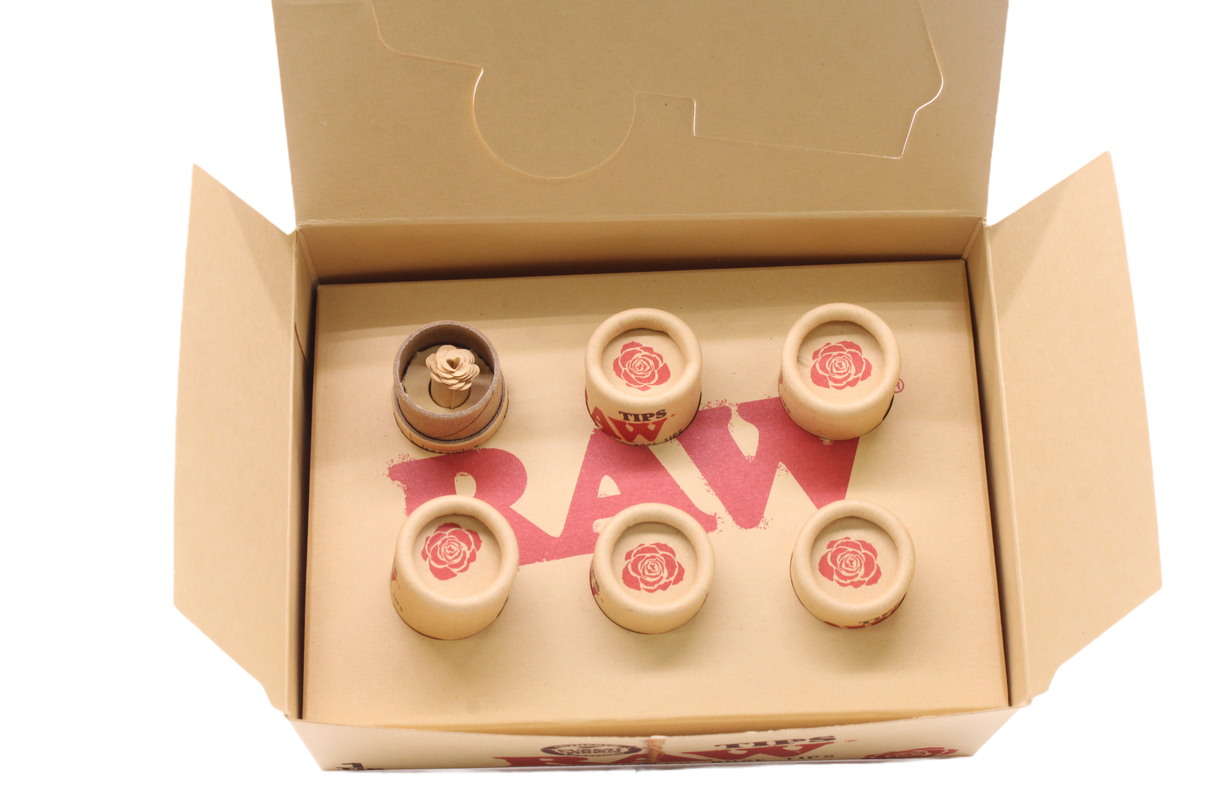 Angled overhead view of the open RAW pre-rolled rose tips box in kraft brown. These ready-to-use pre-rolled filters save consumers time while providing a rigid, structurally sound mouthpiece for custom rolls.