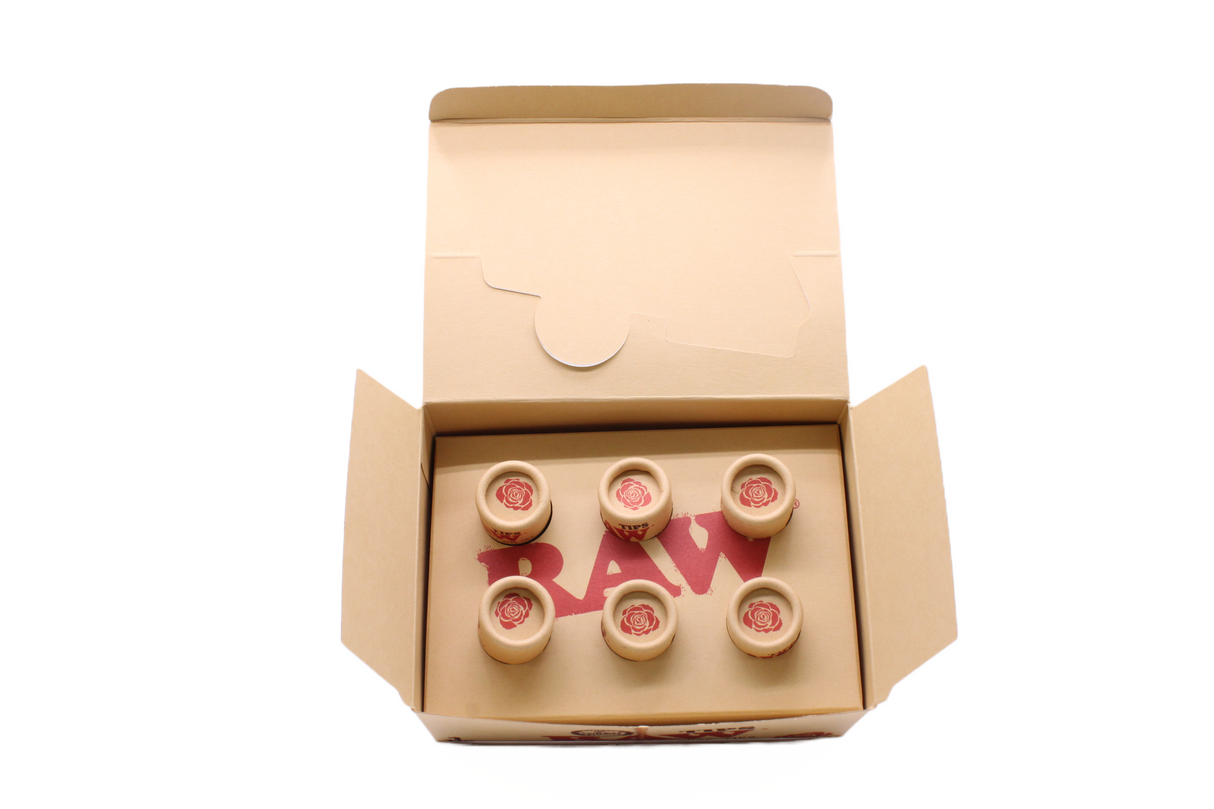 Angled overhead view of the open RAW pre-rolled rose tips box in kraft brown. These ready-to-use pre-rolled filters save consumers time while providing a rigid, structurally sound mouthpiece for custom rolls.