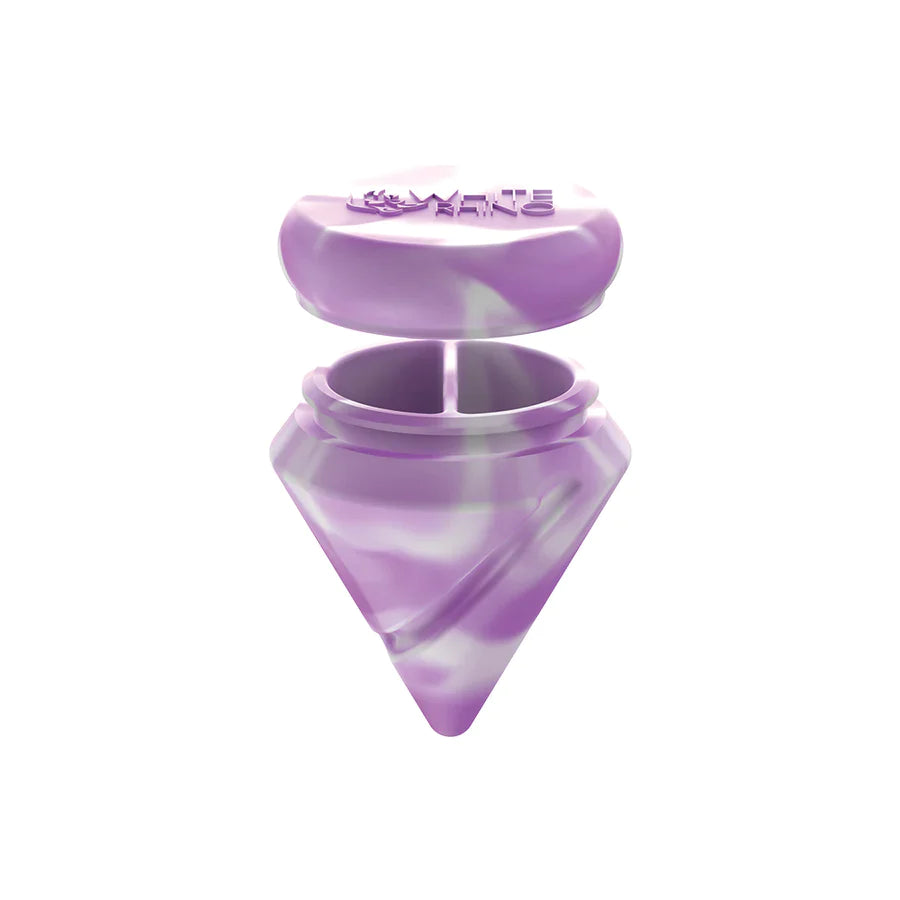 Angled top-down view of the White Rhino diamond spinner carb cap opened to reveal the internal silicone storage jar and the included clear glass terp ball. This 2-in-1 travel-friendly design keeps your sticky concentrates safely stored directly inside your carb cap.