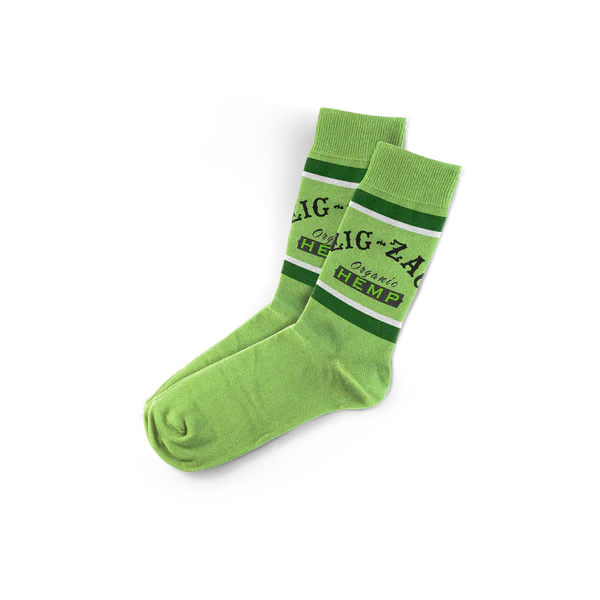 Front flat lay view of a pair of Zig-Zag Hemp Logo Socks in natural cream white with an orange and black knit logo. These premium unisex crew socks blend eco-friendly hemp fiber and soft cotton to provide exceptional breathability and everyday durability.