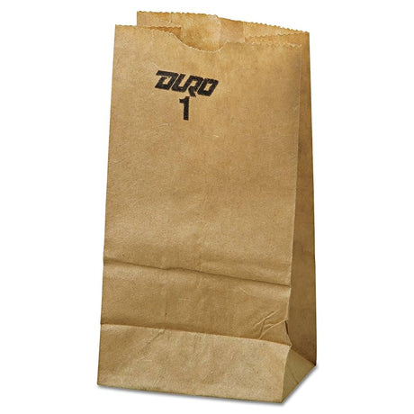 Angled view of the flat, folded bottom of a 1lb kraft paper retail bag in natural brown. These durable, eco-friendly paper bags come in a wholesale 500-count bundle and are ideal for packaging small goods and merchandise at retail checkout.