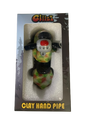Angled profile view of the 5" Glizzy Clay Hand Pipe with a green accent. This novelty food-themed clay smoking instrument is designed to visually replicate a hot dog, featuring an integrated deep-dish bowl and side-carb.