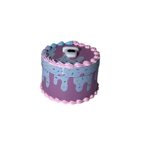 Angled overhead view of the closed 62mm 4-Piece Cake Grinder. This premium 4-part aluminum herb grinder features sharp diamond-cut teeth and a built-in pollen catcher to effortlessly mill dry herbs to the perfect consistency.