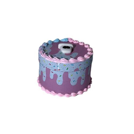 Angled overhead view of the closed 62mm 4-Piece Cake Grinder. This premium 4-part aluminum herb grinder features sharp diamond-cut teeth and a built-in pollen catcher to effortlessly mill dry herbs to the perfect consistency.