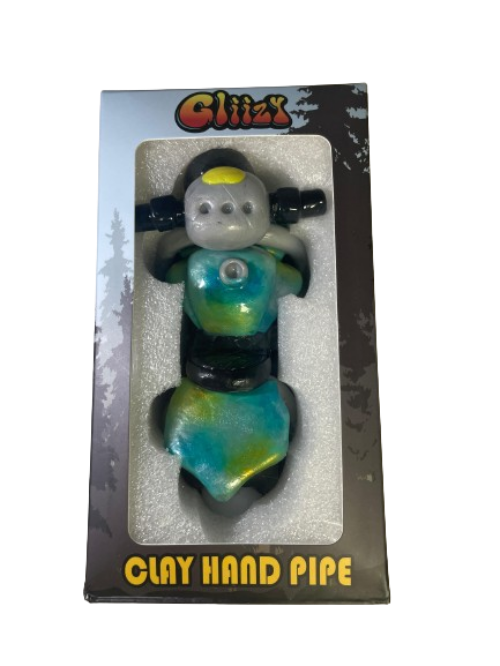 Angled profile view of the 5" Glizzy Clay Hand Pipe with a blue accent. This novelty food-themed clay smoking instrument is designed to visually replicate a hot dog, featuring an integrated deep-dish bowl and side-carb.