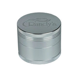 side view of the Randy's Revolution 4 piece grinder in silver. a aluminum premium grinder with sharp teeth that will shred and fluff your herb consistently.