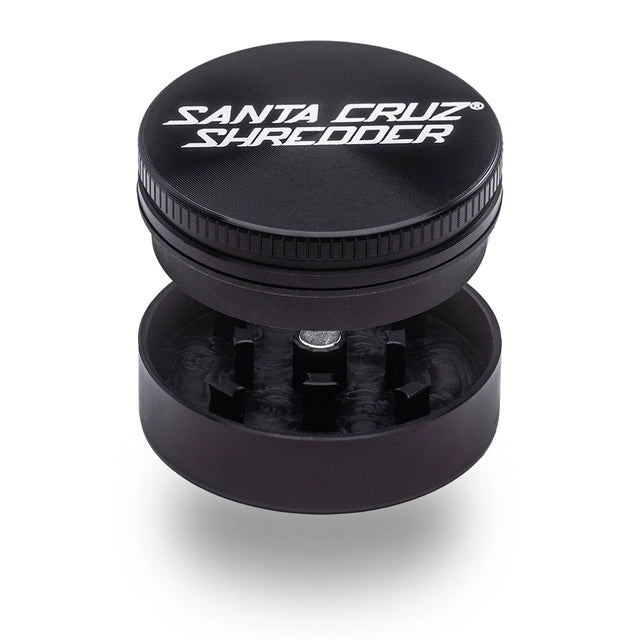 opened view of the 2 Piece Santa Cruz shredder grinder in black. A compact grinder for smokers who need to save on space but not on quality.