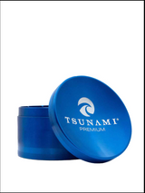 Side view of the Tsunami premium grinder showcasing its concave top, made with precise made aluminum construction for consistent use with reliable results in a blue finish.