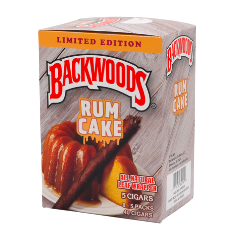 A box of Backwoods Rum Cake cigars, featuring a wood-grain patterned background, an orange banner reading 'LIMITED EDITION', and an illustration of a sliced rum cake with cinnamon sticks.