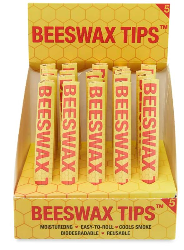 Front angled view of the Beeswax Filter Tips 20-count display carton in natural yellow packaging. These cosmetic-grade biodegradable wax filters feature a naturally tacky exterior to securely grip rolling papers while actively moisturizing the lips during use.