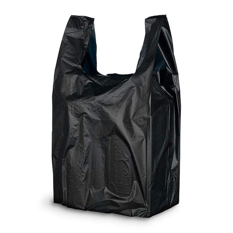 Side profile view of an opened black plastic t-shirt bag hanging by its dual handles to showcase the expandable side gussets. This strong, tear-resistant bag expands laterally to easily accommodate bulky grocery items or multiple heavy retail goods without ripping.