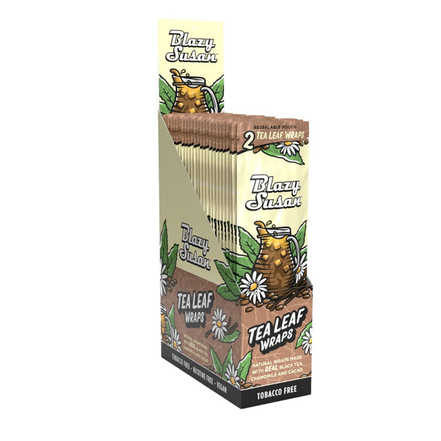 Front angled view of the brown and beige Blazy Susan King Size Tea Leaf Wraps in a 10-count retail display carton. These expanded botanical sheets are formulated from black tea, chamomile, and cacao with a natural moisture-activated seal, bypassing standard tobacco entirely.