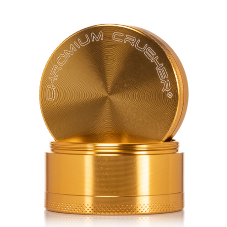 front view of the chromium crusher 2.2" 4 piece grinder. premium and sturdy grinder for botanical herb in gold.