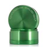 front view of the chromium crusher 2.2" 4 piece grinder. premium and sturdy grinder for botanical herb in green.
