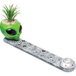 Front view of the Fujima Alien incense burner in grey and green with a faux succulent plant. This 12.25-inch long polyresin burner accommodates both incense sticks and cones to create an otherworldly aroma for relaxation.