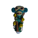 Front view of the 5-inch Glizzy Ceramic Monkey Mushroom Pipe featuring a brown monkey sitting on a red and white spotted mushroom. This novelty hand pipe utilizes a high-density fired clay construction that serves as a rigid, heat-resistant barrier to actively dissipate thermal exhaust.
