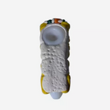 Alternate angled view of the 5-inch Glizzy Ceramic Sushi PSD Pipe in white, black, and coral pink. Designed to visually replicate a piece of Japanese sushi, this high-density ceramic pipe features a flat-backed tabletop stability design that physically prevents accidental ash spillage between active sessions.