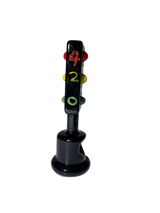 Side profile view of the 5-inch Glizzy Ceramic Traffic Light Pipe in opaque black. Designed directly after a classic intersection signal, this novelty pipe features an integrated ceramic basin for processing unrefined botanical materials.