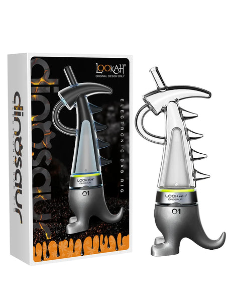 Front profile view of the Lookah Dinosaur Electric Dab Rig in sleek gray. This portable e-rig features a unique dinosaur-shaped glass water bubbler and a magnetic quartz coil to deliver smooth, water-filtered hits from your wax concentrates.
