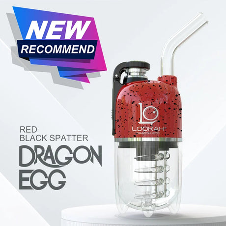 Angled front view of the Lookah Dragon Egg Electric Dab E-Rig showcasing a bold red surface accented with sharp black splatter. This capsule-style portable e-rig features a unique bottom-mounted water bubbler and a magnetic cap to deliver cool, smooth, and filtered concentrate hits on the go.