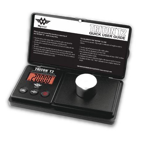 Front angled view of the open MyWeigh Triton T2 300g scale in black. The interface showcases an easy-to-read backlit LCD display and a stainless steel weighing platform that delivers highly accurate 0.1g measurements for dry herbs.