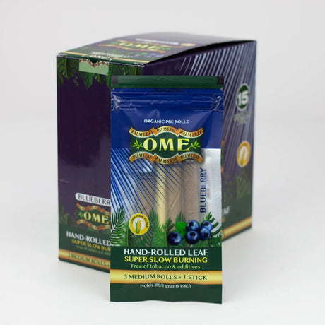 Front view of the closed OME hand rolled tendu leaf wraps 15-count display box in blue and purple. This wholesale retail display provides shops with premium, tobacco-free pre-rolled palm leaf wraps for a smooth and slow-burning smoke.