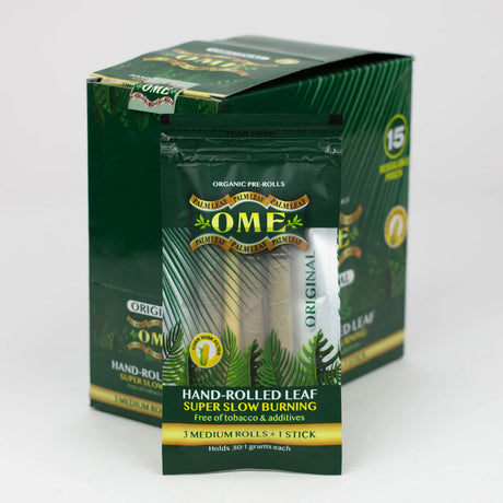 Angled overhead view of the open OME hand rolled tendu leaf wraps display box in green. The convenient pop-up retail design perfectly presents the individual pouches for easy customer browsing and quick point-of-sale purchases.