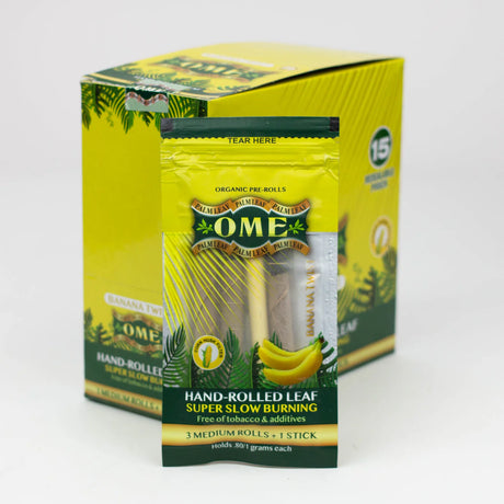 Front view of the closed OME hand rolled tendu leaf wraps 15-count display box in bright banana yellow. This wholesale retail display provides shops with premium, tobacco-free pre-rolled palm leaf wraps for a smooth and slow-burning smoke.