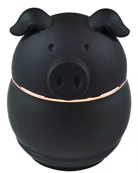 Front angled view of the 62mm piggy shape metal grinder in solid black. This 4-piece novelty swine-themed unit features internal metal teeth to physically shred botanical matter.