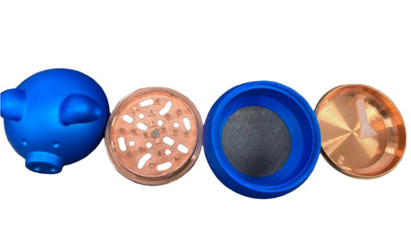 Overhead disassembled view of the 62mm piggy shape metal grinder in blue, showcasing its separated internal chambers. This 4-piece novelty swine-themed unit features an integrated metal mesh screen for isolating and collecting pollen.