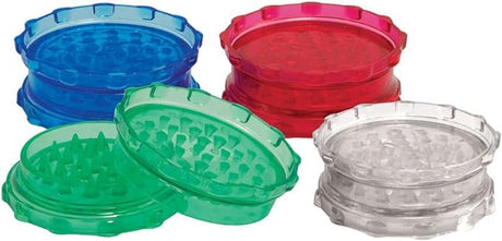 Front view of the Plastic Grinder Large Assorted Colors. This retail-ready package holds ten large acrylic grinders in a mix of vibrant neon translucent shades, offering a cost-effective bulk solution for smoke shops.