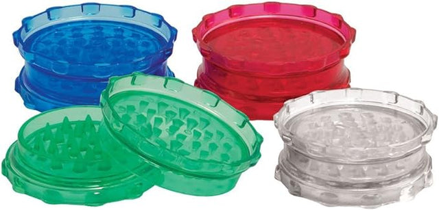 Front view of the Plastic Grinder Large Assorted Colors. This retail-ready package holds ten large acrylic grinders in a mix of vibrant neon translucent shades, offering a cost-effective bulk solution for smoke shops.