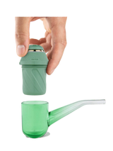Exploded view of the Puffco Proxy Kit showing the green electronic base unit separated from the glass pipe stem. This illustrates the modular design that allows the core heating unit to adapt to various custom glass attachments.
