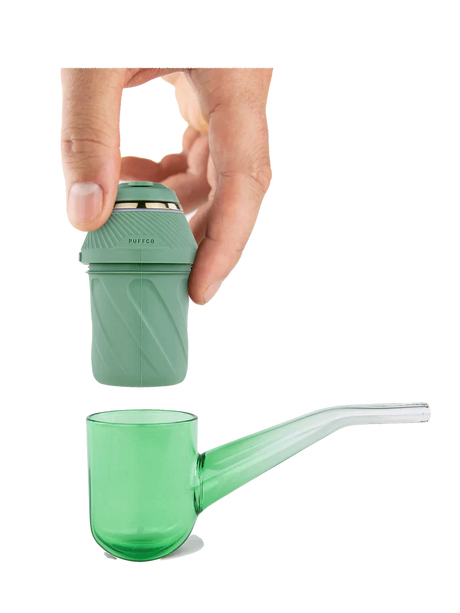 Exploded view of the Puffco Proxy Kit showing the green electronic base unit separated from the glass pipe stem. This illustrates the modular design that allows the core heating unit to adapt to various custom glass attachments.