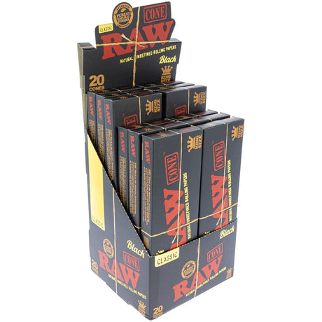 Front angled view of the RAW Black Classic Cones King Size 20-Pack Box in sleek black and gold packaging. Made from RAW's thinnest double-pressed unbleached natural paper, these pre-rolled king size cones deliver an exceptionally clean, slow-burning smoke.