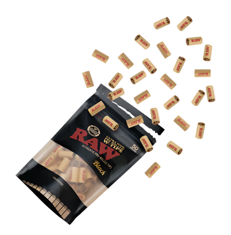 Close-up view of the raw, unrefined brown plant fibers and internal structural folds on the RAW Black Extra Wide Pre-Rolled Tips. These vegan paper filters feature a wider cylindrical profile to increase overall airflow and naturally cool down hot smoke.