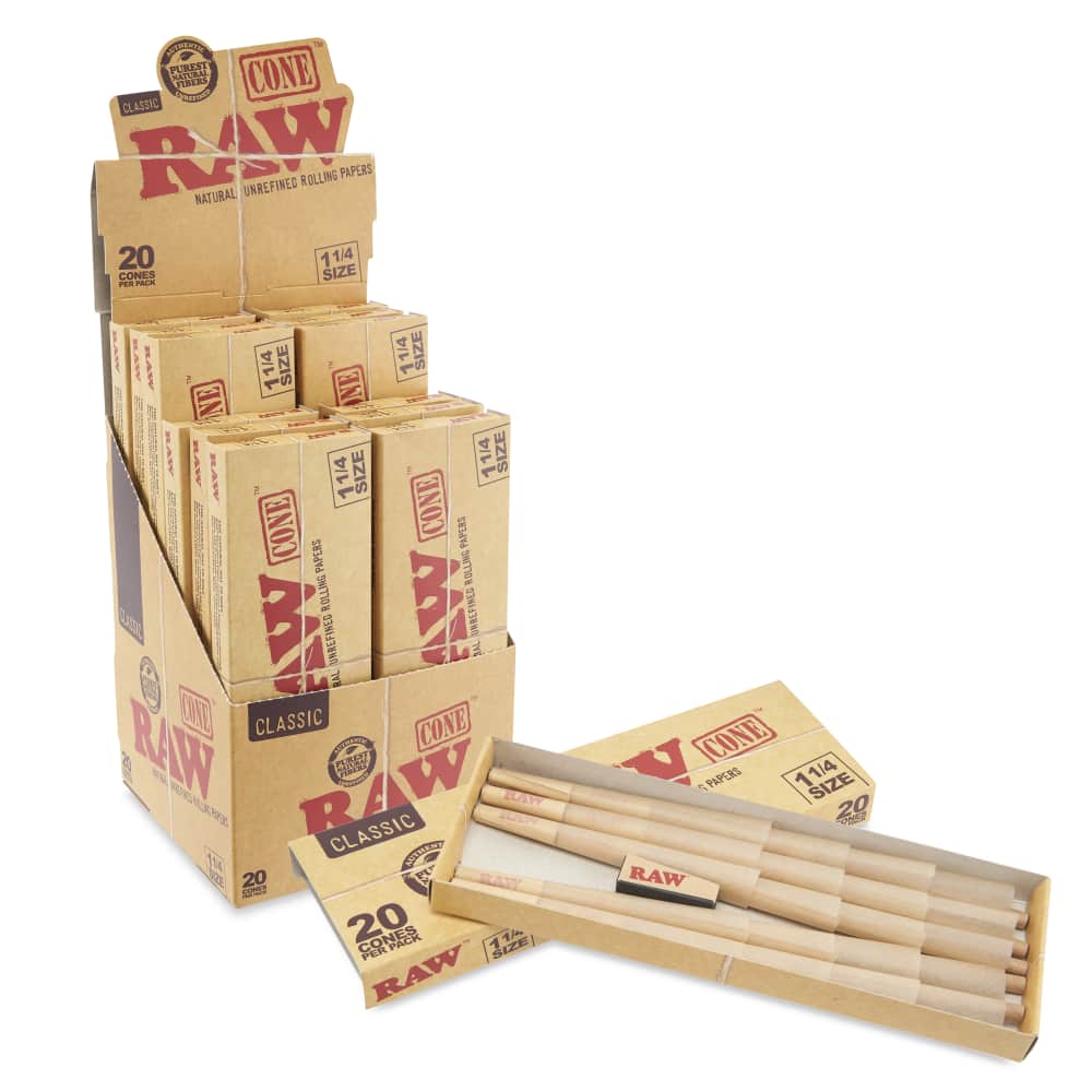 Angled overhead view of the RAW Classic 1 1/4 Pre-Rolled Cones 20-Pack box in natural brown. Showcasing the slide-out tray opened, this 20-count package provides frequent smokers with an ample supply of ready-to-fill unbleached classic cones.